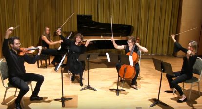 A picture of a string quartet finishing off a concert