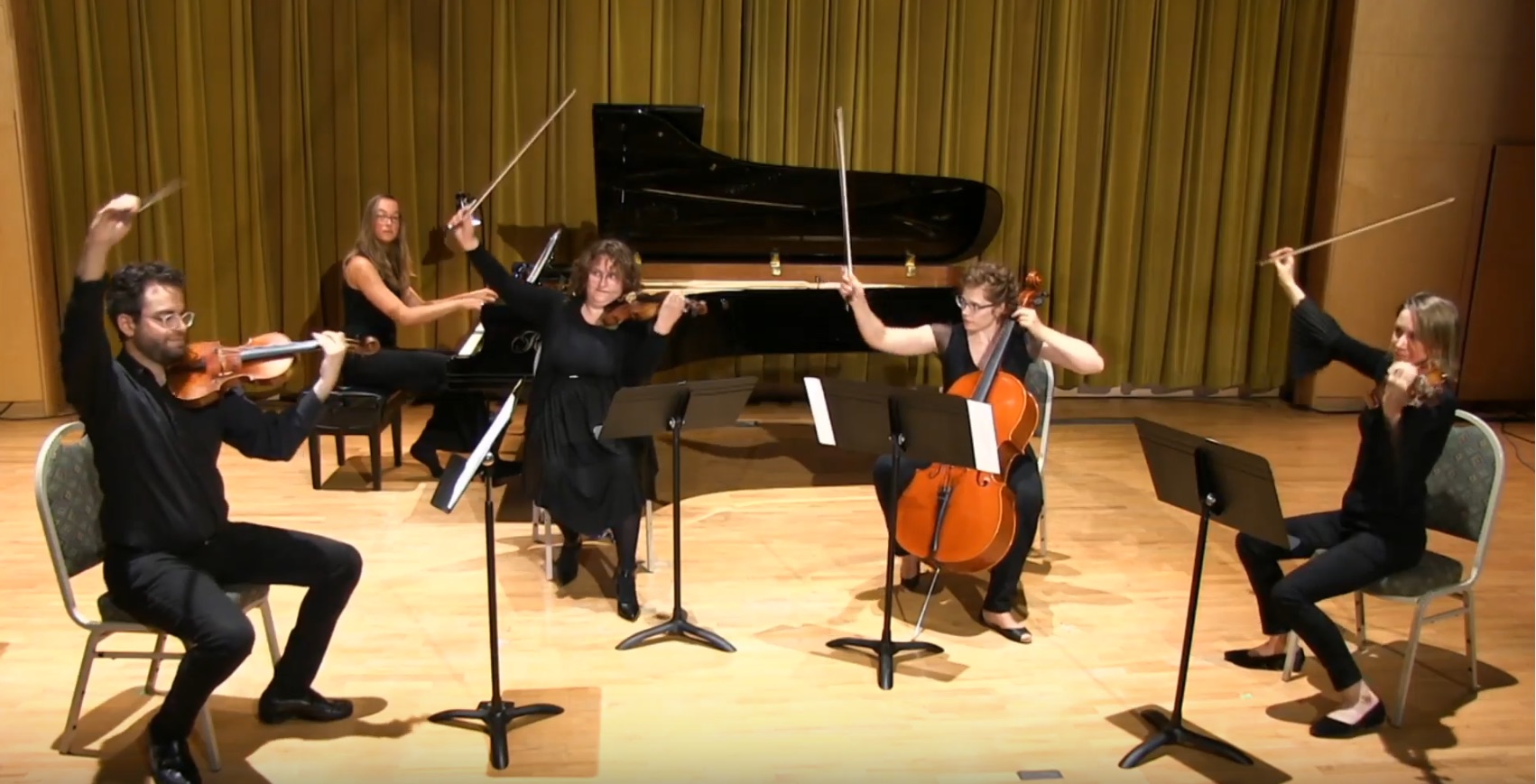 A picture of a string quartet finishing off a concert