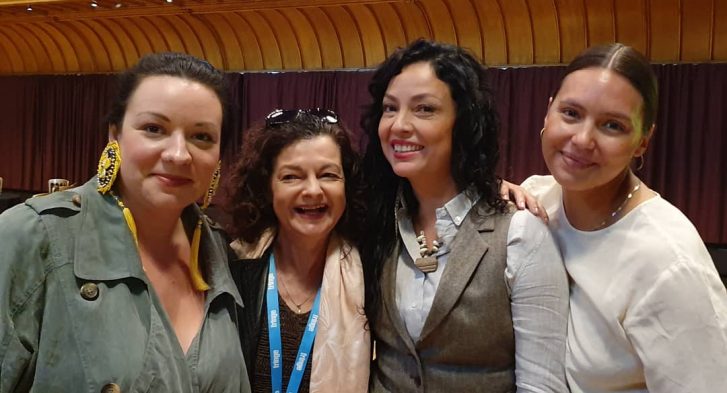 Four participants from the 2019 Edinburgh Fringe/CAPACOA group posing shoulder to shoulder.