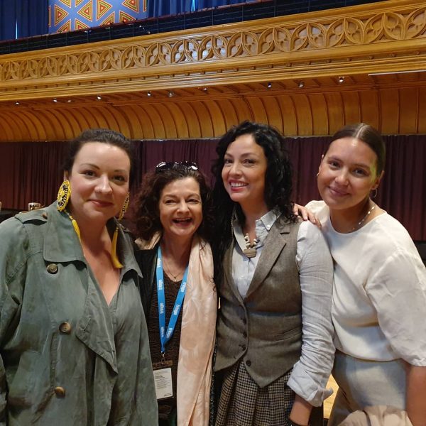 Four participants from the 2019 Edinburgh Fringe/CAPACOA group posing shoulder to shoulder.