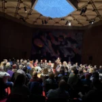 A large crowd seated in chairs