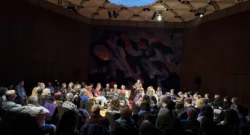 A large crowd seated in chairs