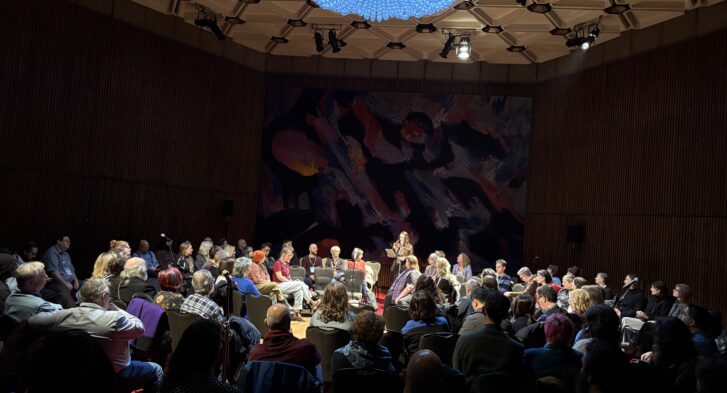 A large crowd seated in chairs