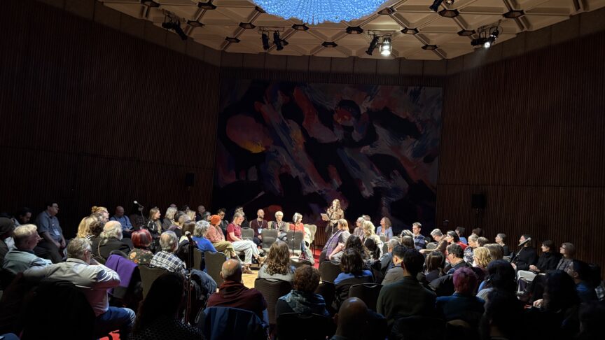 A large crowd seated in chairs