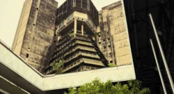 In the commercial heart of Abidjan (Le Plateau district), an MC announces the next MASA event in the courtyard of the Institut Français de Côte d'Ivoire - a key example of post-independence Tropical Brutalism. Raw exposed concrete sunshades and bold geometric volumes were characteristic of 1970s public architecture in West Africa.